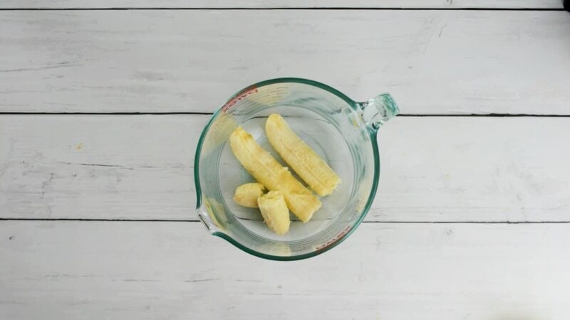Bananas in a glass bowl.