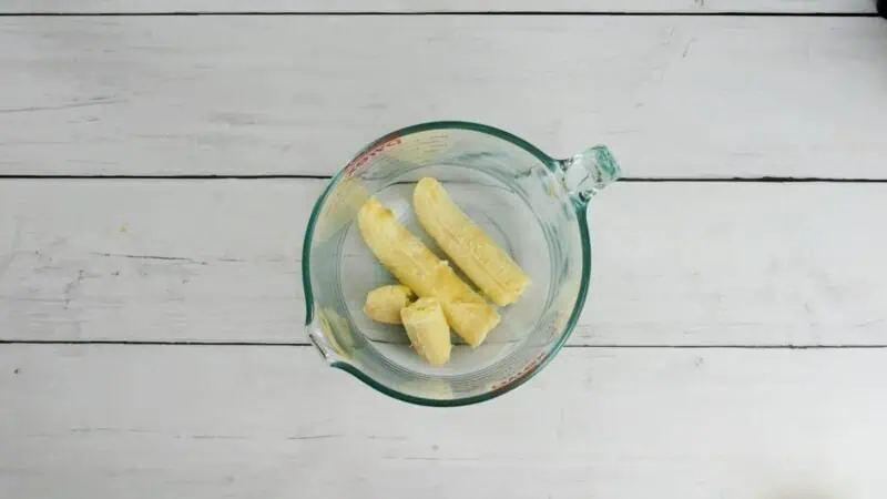 Bananas in a glass bowl.