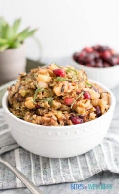 Wild Rice Stuffing is the perfect addition to your dinner or weeknight meal. It’s super simple and full of fall flavors! It’s gluten free and vegetarian! | https://bitesofwellness.com