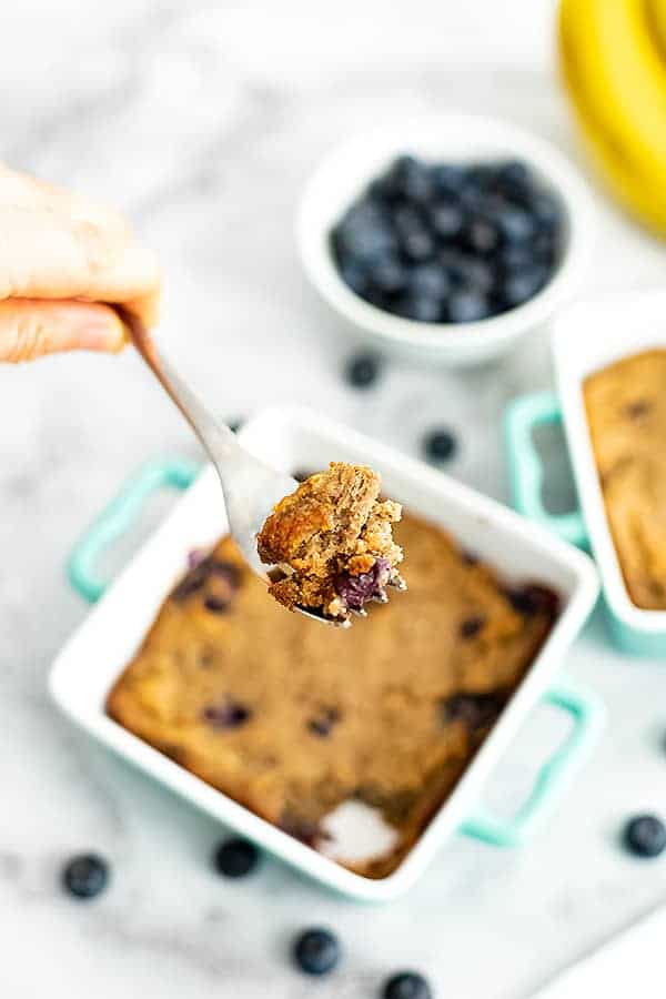 Single serve blueberry banana bread recipe in a teal baking dish