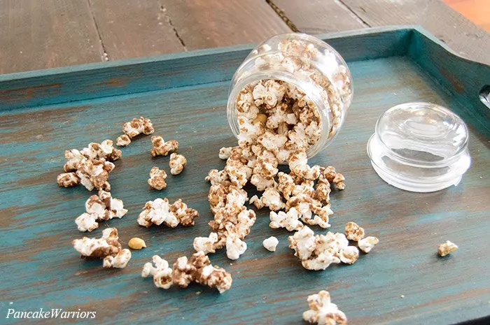 Chocolate Popcorn spilling out onto a plate