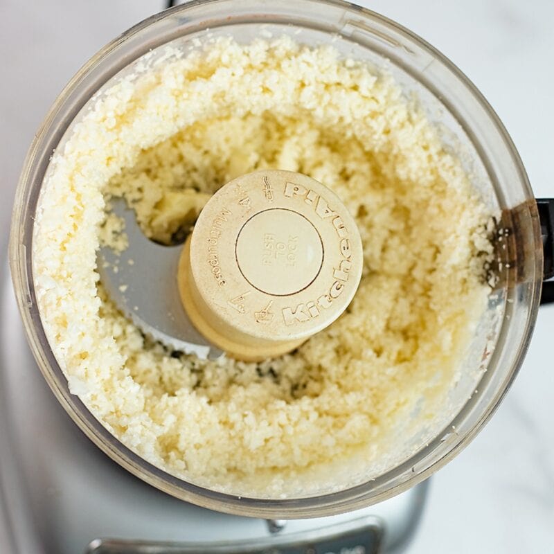 cauliflower broken down into rice in a food processor.