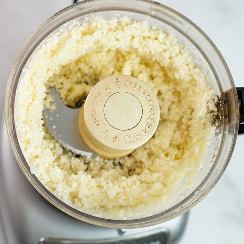 cauliflower broken down into rice in a food processor.