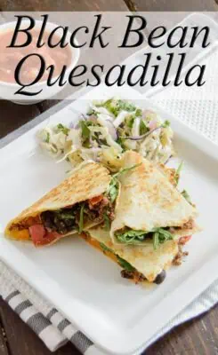 Black Bean Quesadilla with slaw on the side on a white plate
