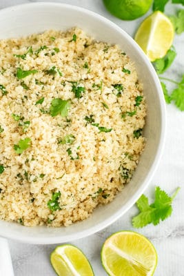 Love your veggies with this easy cilantro lime cauliflower rice! This simple side dish is ready in minutes and super tasty! Vegan, gluten free, low fat, paleo. low carb! | www.pancakewarriors.com
