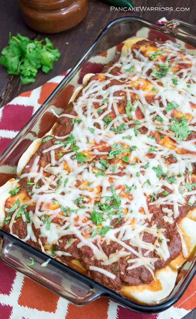 pumpkin black bean enchilada topped with cheese and sauce