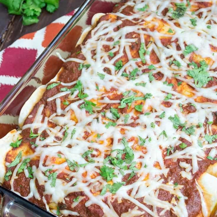 Easy pumpkin black bean enchiladas with easy, homemade enchilada sauce! Gluten free, ready in about 30 minutes, these enchiladas are sure to please a crowd! The perfect fall meal!