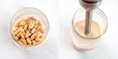 White beans and dairy free milk being blended with an immersion blender.