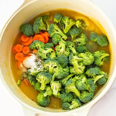 Broccoli florets and carrots added to cauliflower soup base.