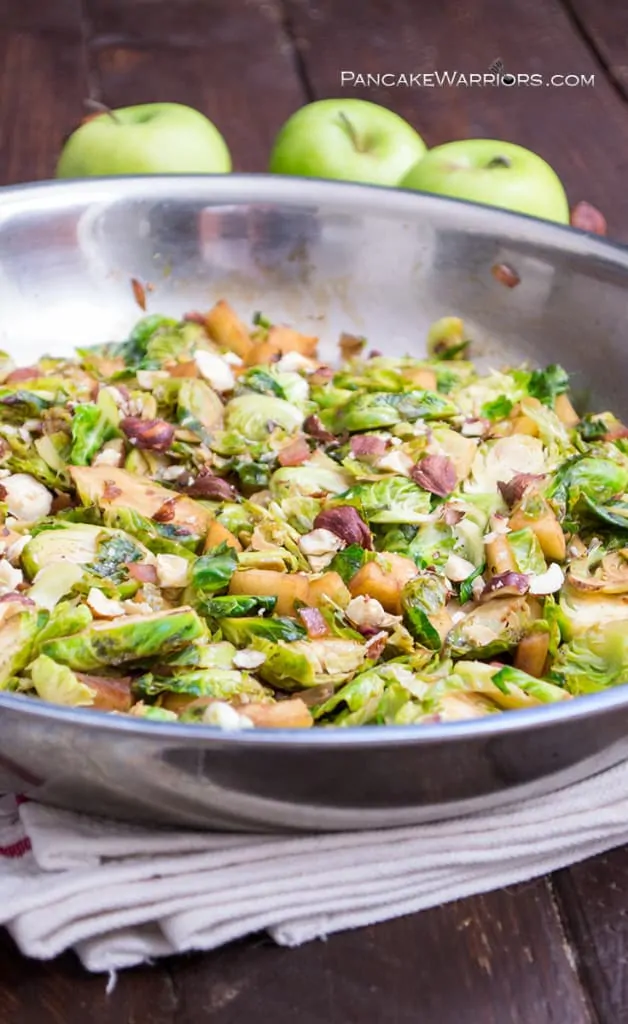 Apple Brussels Sprouts Hash in stainless steel skillet on a white napkin