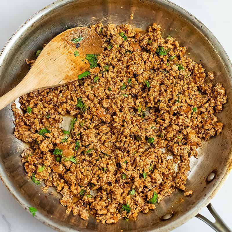 Seasoned ground turkey mixture in skillet for bell pepper nachos.