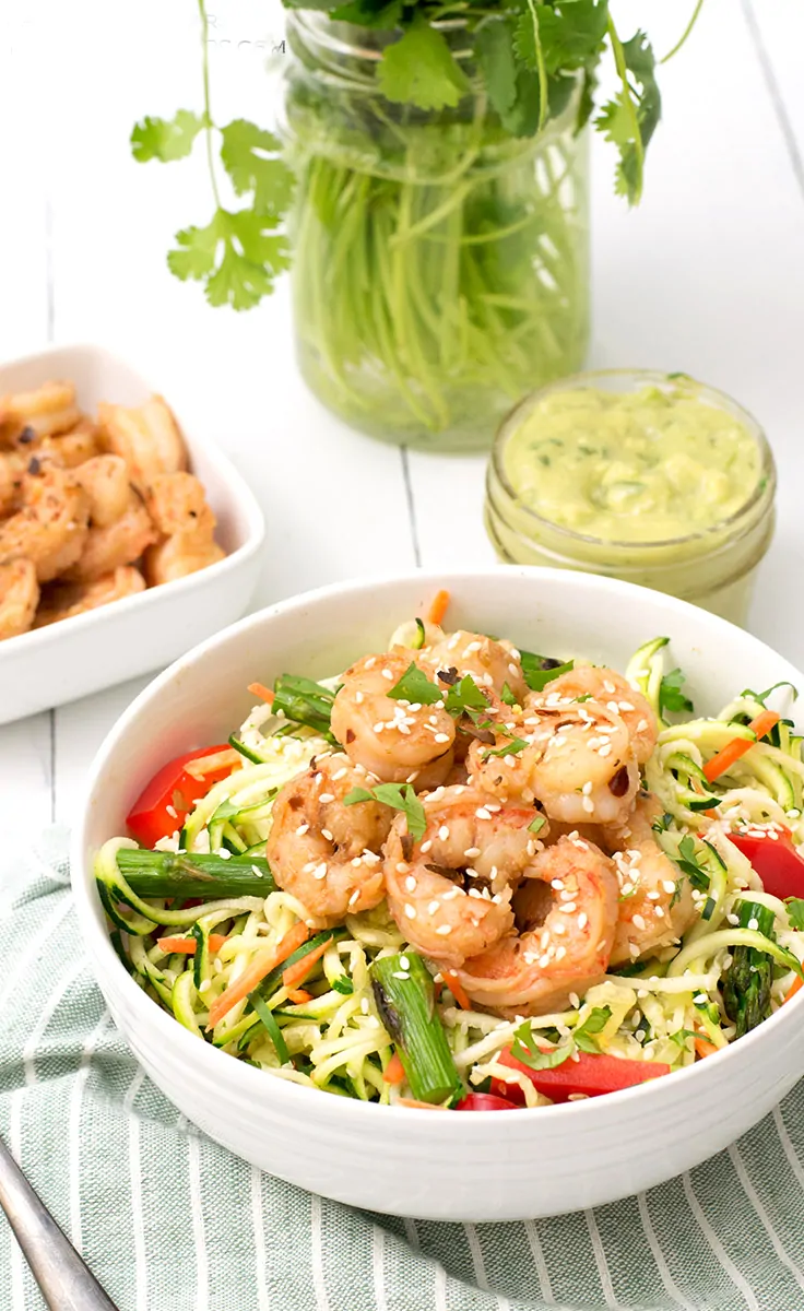 ginger garlic shrimp zoodle bowl packed with shrimp and zoodles