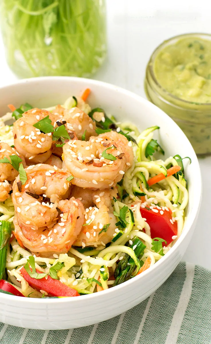 ginger garlic shrimp zoodle bowl packed with shrimp and zoodles