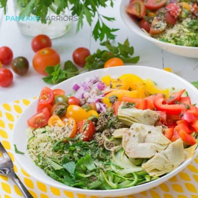 Greek Zoodle Bowl with bell peppers, artichoke hearts and tomatoes