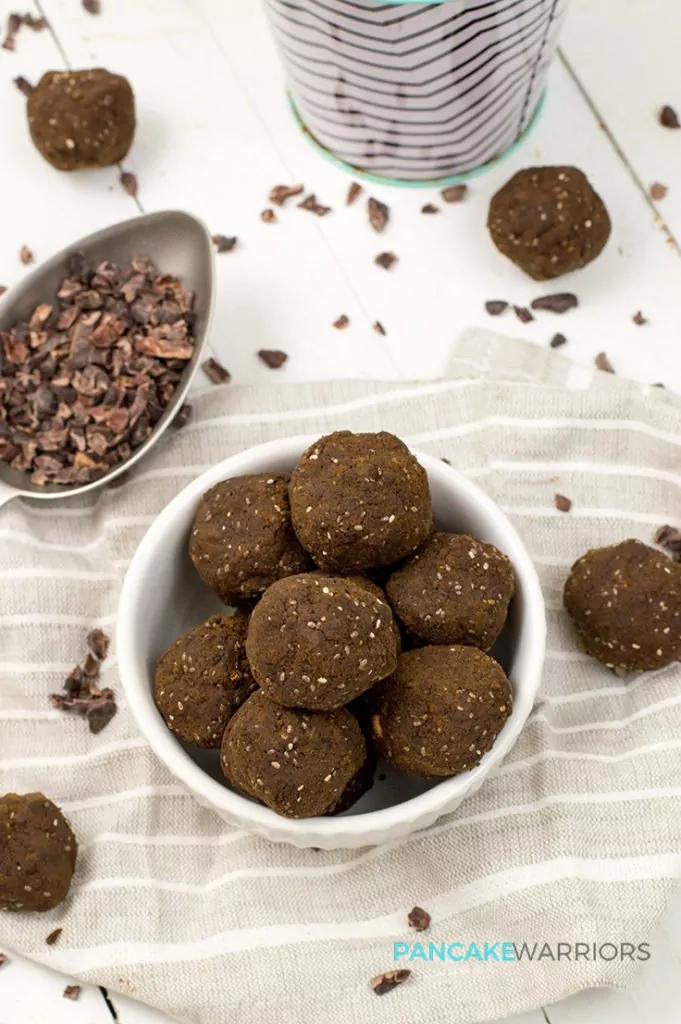 hemp protein brownie bites in a bowl with cocoa nibs