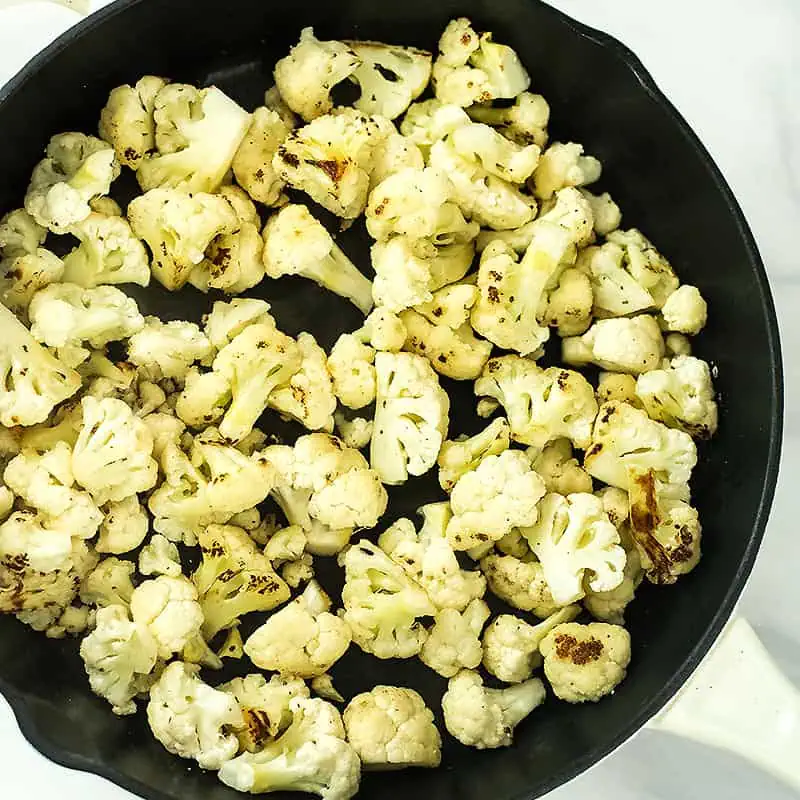 Cauliflower florets after cooking in the skillet.