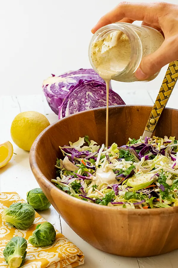This cruciferous crunch salad with lemon tahini dressing is going to become your new go-to meal prep salad. Vegan, gluten free, paleo and Whole30 approved! | https://bitesofwellness.com