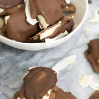 These homemade almond joy candy bars are made with 100% real ingredients and have no processed sugar. Gluten free, grain free, paleo friendly, and vegan. | bitesofwellness.com #dessert #vegan #dairyfree