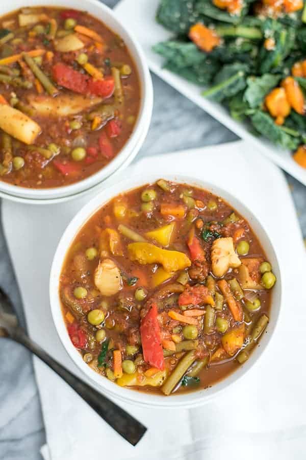 This super simple frozen vegetable soup is ready in under 30 minutes and doesn't require any chopping! This recipe is vegan, paleo, Whole30 and so easy to make! #soup #vegan #dinner #vegetablesoup | bitesofwellness.com