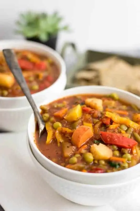 This super simple frozen vegetable soup is ready in under 30 minutes and doesn't require any chopping! This recipe is vegan, paleo, Whole30 and so easy to make! #soup #vegan #dinner #vegetablesoup | bitesofwellness.com