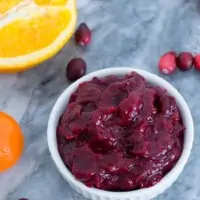 This orange ginger homemade cranberry sauce is naturally sweetened and will be your new favorite way to enjoy cranberry sauce. Vegan, paleo and ready in 7 minutes. | bitesofwellness.com