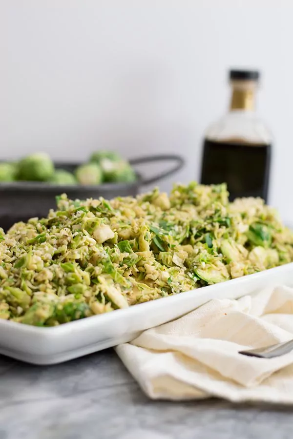 Shaved brussels sprouts salad with creamy balsamic dressing