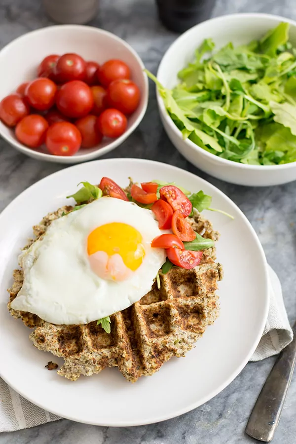 Savory cauliflower waffles with an egg and veggies