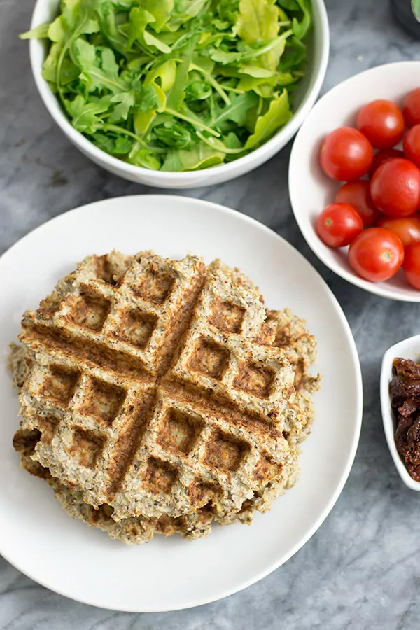 Two savory cauliflower waffles with vegetables