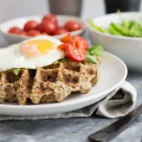 These simple low carb savory cauliflower waffles are going to become your favorite breakfast recipe! Paleo, whole30, vegetarian and low carb! So simple and filling! #paleo #whole30 #waffles #breakfast