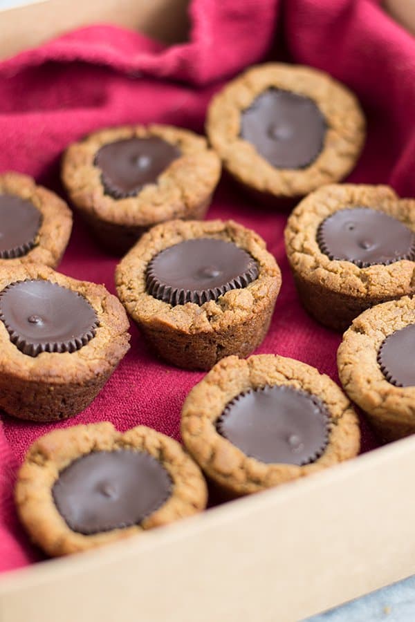 Chocolate combined with peanut butter, is there anything better? These dark chocolate peanut butter cup cookies are my new all time favorite and they will be yours too! #glutenfree #vegan | https://bitesofwellness.com