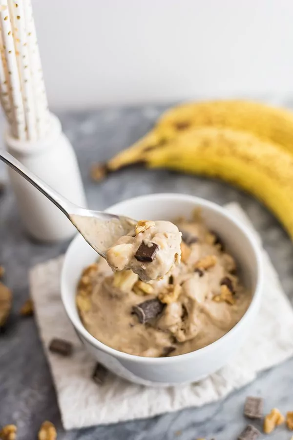 Homemade chunky monkey ice cream spoon full of ice cream