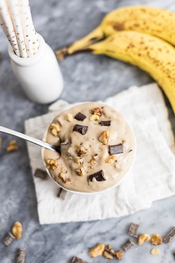 This homemade chunky monkey ice cream is the perfect sweet treat! Vegan, dairy free, and has a paleo option as well! No ice cream maker required! #vegan #dairyfree #icecream #paleo