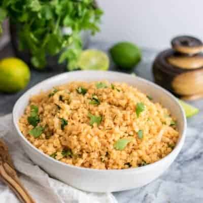 This whole30 Mexican cauliflower rice is the perfect side dish for your Mexican style meals! Paleo, vegan, grain free and ready in 10 minutes! Perfect for meal prep as well! | #whole30 #vegan #paleo #mexcian | bitesofwellness.com