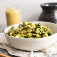 This paleo brussels sprouts with creamy dijon sauce is the perfect weeknight side dish! Whole30, vegan, dairy free, grain free and super simple to prepare! | #paleo #brusselssprouts #whole30 #vegan | bitesofwellness.com