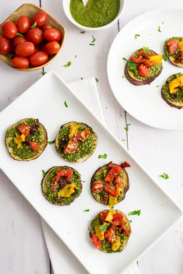 Sweet potato pizza bites on a white rectangular plate