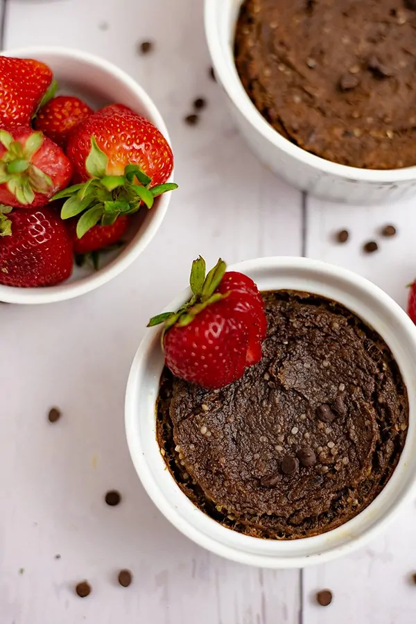 Overhead shot of a single serve brownie in a white ramekin