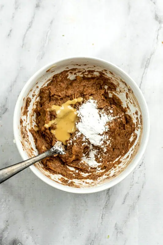 Almond butter and baking powder added to brownie mixture.