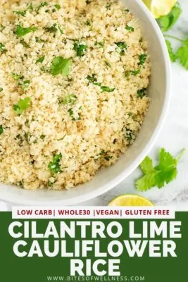 Square bowl filled with cilantro lime cauliflower rice with lime wedges and cilantro on top.