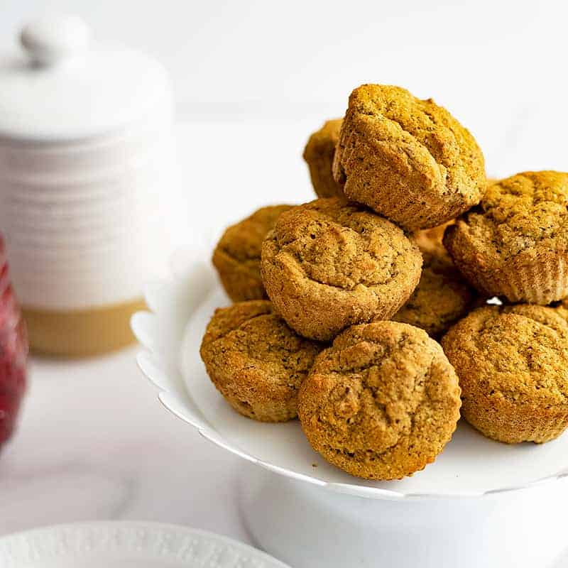 White serving plate filled with gluten free almond flour muffins 