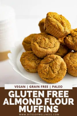 White serving plate filled with gluten free almond flour muffins with pinterest text on the bottom of the photo
