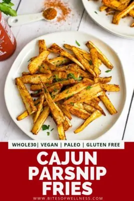 Plate filled with cajun parsnip fries with pinterest text on the bottom of the photo