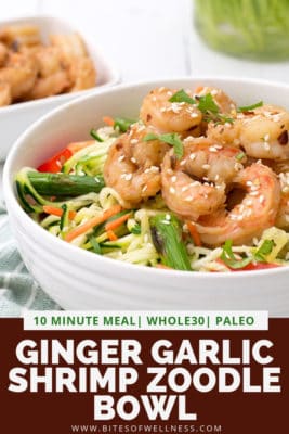 Large white bowl filled with ginger garlic shrimp zoodle bowl with pinterest text on the bottom of photo