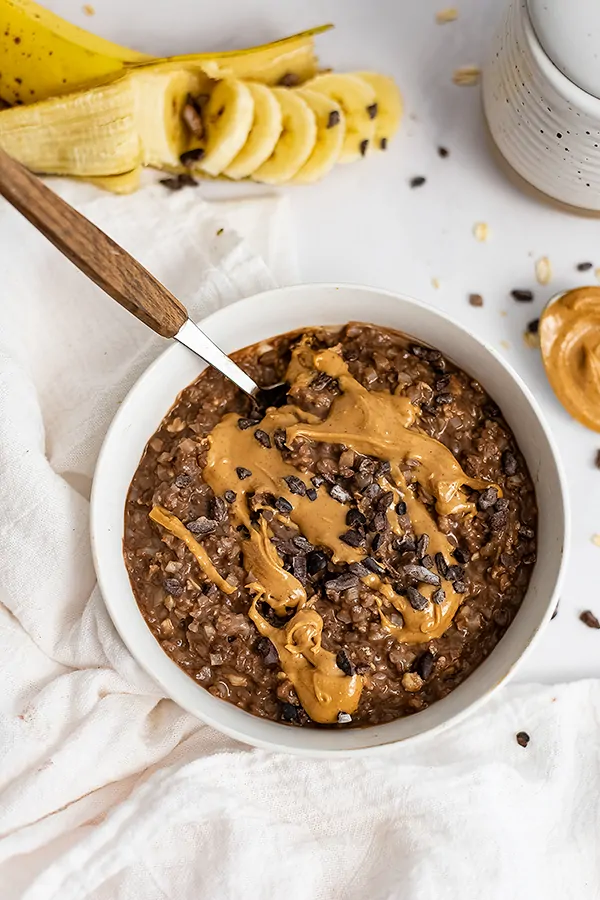 Bowl with Chocolate Peanut Butter Swirl High Protein Oatmeal with a spoon