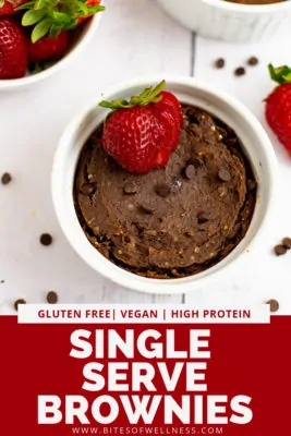 Overhead shot of a single serve brownie topped with a single strawberry with chocolate chips around the dish. Pinterest text on the bottom of the photo