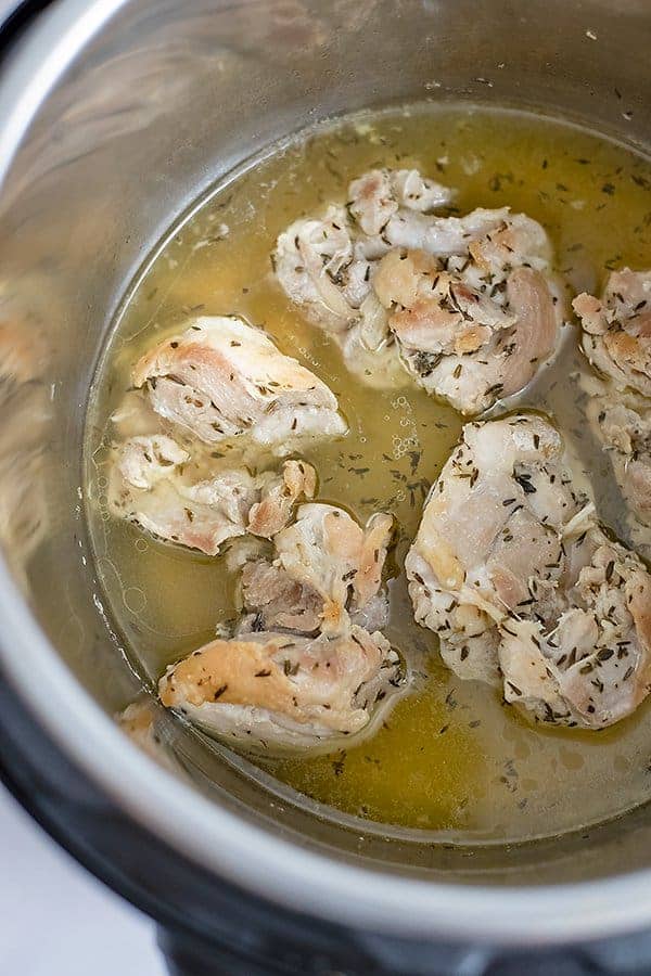 Instant Pot Shredded Chicken Thighs in the instant pot after cooking before shredding