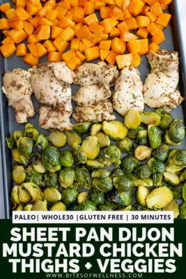 Sheet pan filled with butternuts squash cubes, dijon mustard chicken thighs and halved brussel sprouts with pinterest text on the bottom of the photo