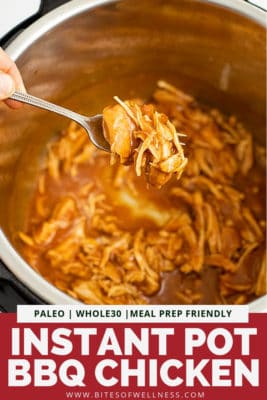 Instant pot full of instant pot bbq chicken with a fork holding up the shredded chicken over the instant pot. Pinterest text on the bottom of the photo