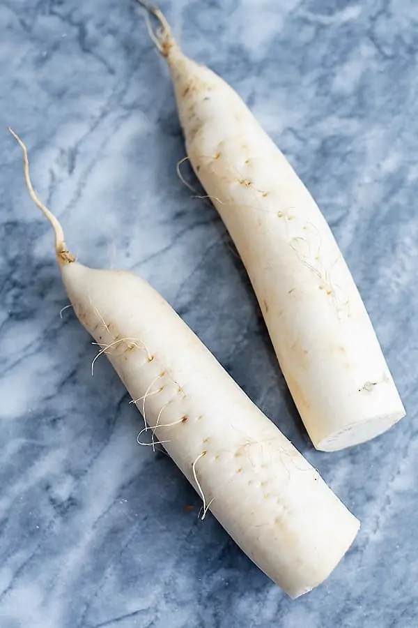 Two daikon radish before making them into low carb pasta