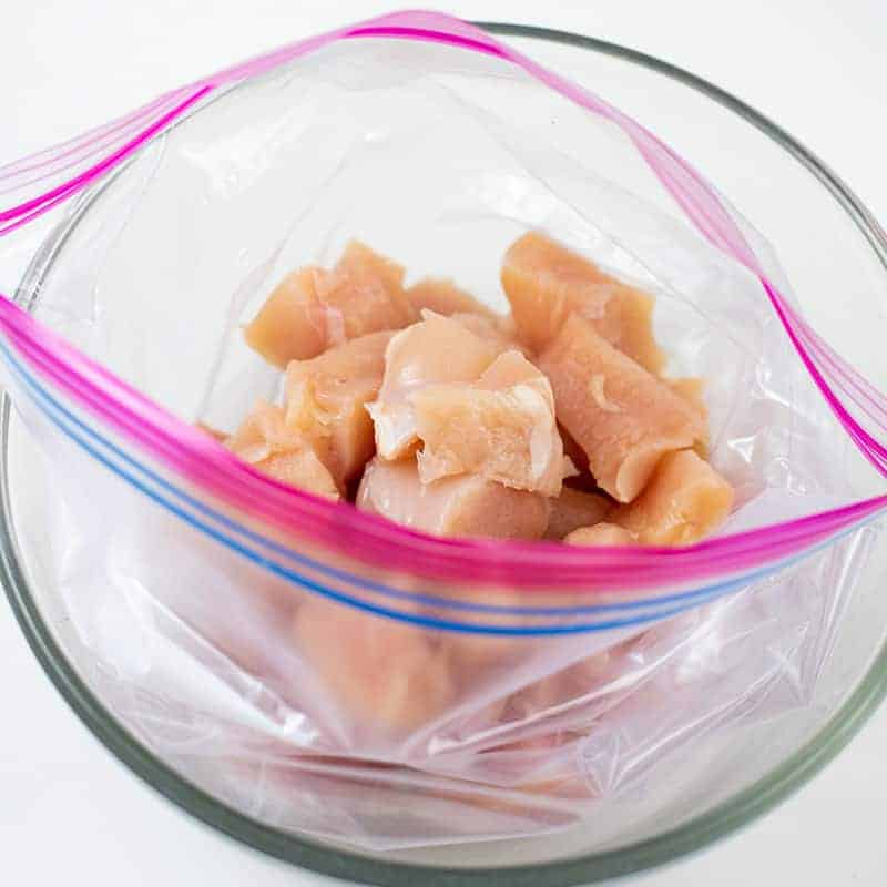 Zip lock bag filled with raw chicken