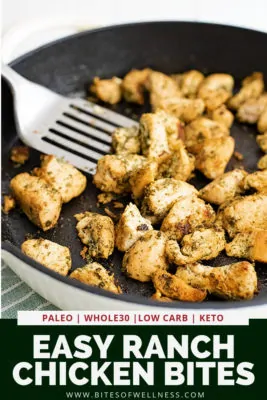 Overhead shot of a cast iron skillet filled with ranch chicken bites with a silver spatula in the pan with the chicken. Pinterest text on the bottom